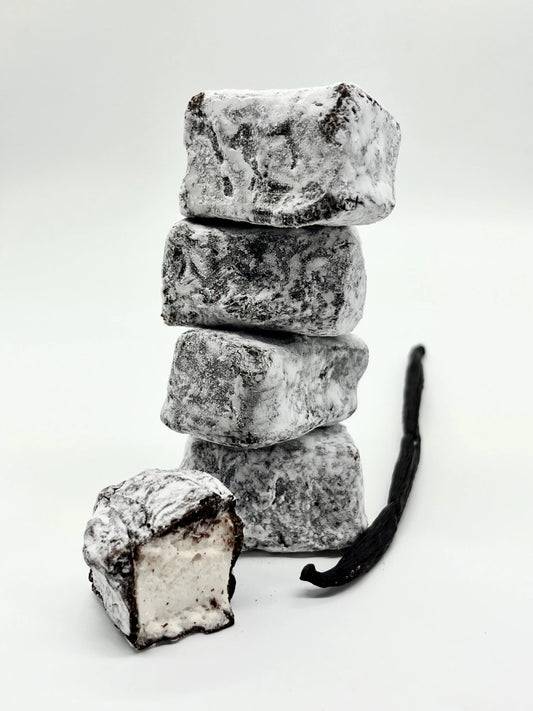 Gorvett & Stone honey and vanilla marshmallow dipped in dark chocolate, showcasing creamy marshmallow covered in rich chocolate coating.