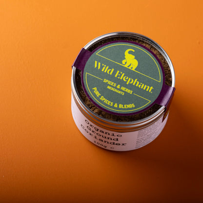 Organic ground coriander spice in a jar from Whole Food Earth, part of their herbs and spices collection.