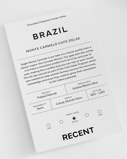 Medium roast Eagle Monte Carmelo Coffee from Recent Beans, showcasing roasted coffee beans in a natural setting.