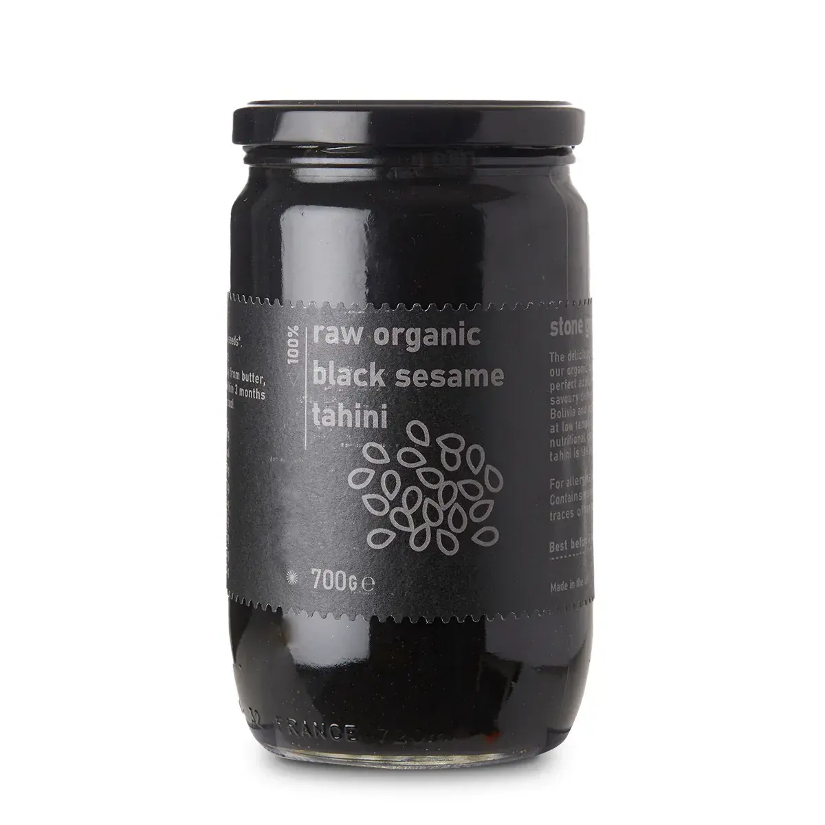 Raw Organic Black Sesame Tahini spread from Whole Food Earth, showcasing a thick, creamy black sesame paste in a jar.