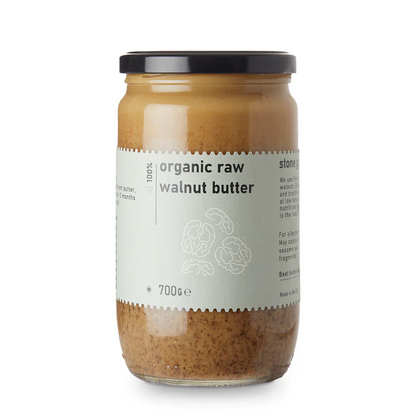 Organic raw walnut butter from Whole Food Earth in a jar, showcasing a smooth, creamy nut butter with walnut pieces visible.