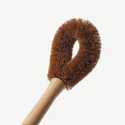 Wild and Stone coconut fibre dish brush with a wooden handle, ideal for eco-friendly kitchen cleaning and dish washing.