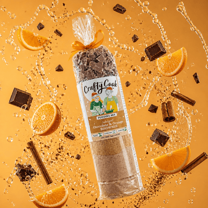 Gluten-free Christmas chocolate and orange brownie mix by Crafty Cook, showing a colorful box with brownies and oranges.