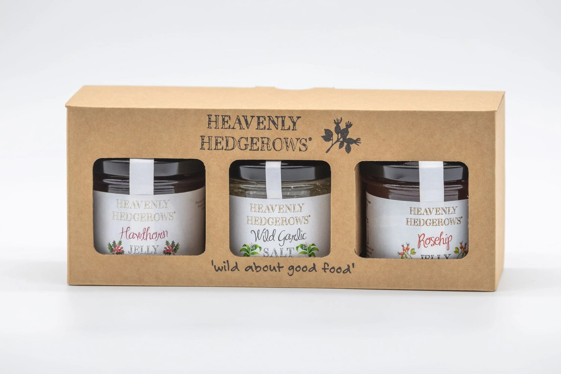 Heavenly Hedgerows Foraged Preserve Gift Pack with assorted jars of handcrafted fruit preserves in a decorative package.