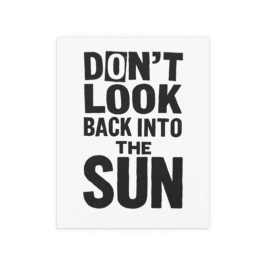 Poster of The Libertines' "Don't Look Back Into The Sun" in black and white, featuring band artwork on a white background.