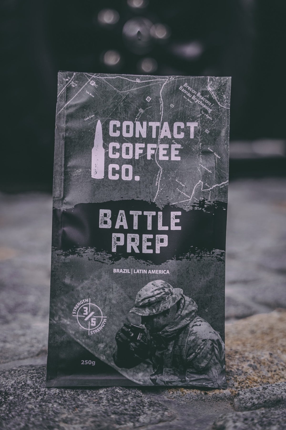 A close-up of a bag of ArtisanBox Battle Prep Coffee with label showing coffee beans and brewing instructions.