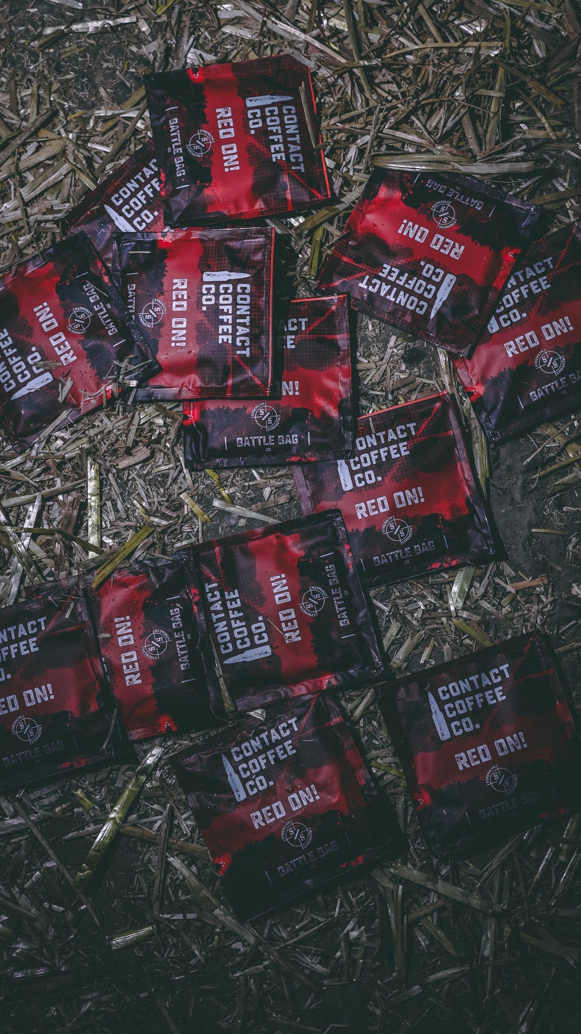 Red single-serve coffee brew bag by Contact Coffee Company Ltd., ready for brewing, with vibrant red packaging and coffee grounds inside.