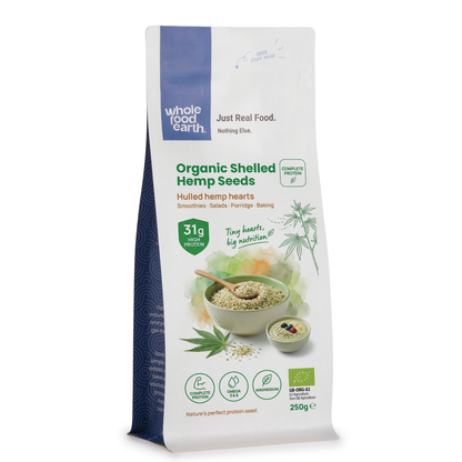 Organic shelled hemp seeds from Whole Food Earth, close-up of greenish seeds in a clear bowl on a white background.