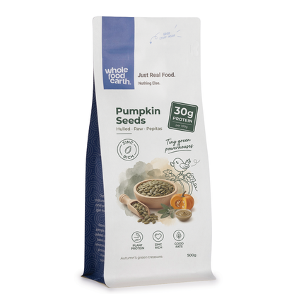 Raw pumpkin seeds from Whole Food Earth, a nutritious nut and seed snack with green shells and a crunchy texture.