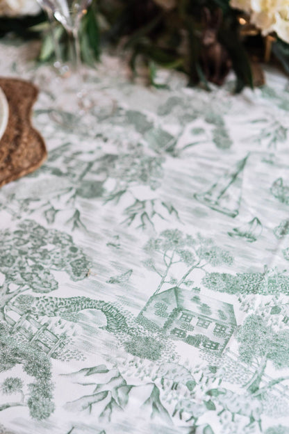 Avalon Home UK Lake District Toile tablecloth featuring classic blue and white scenic pattern, draped over a dining table.