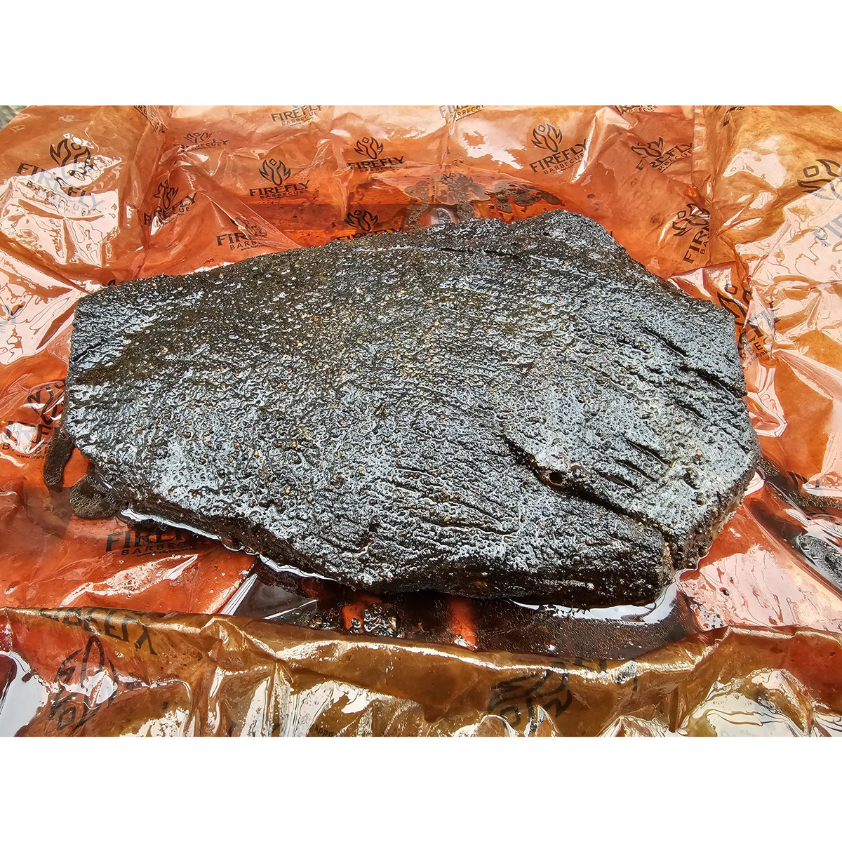 FireFly Barbecue Black Magic Charcoal Beef Rub in a jar, showcasing the spicy, dark seasoning blend for grilling and BBQ.
