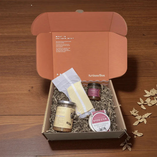 ArtisanBox Discovery Club subscription box with curated artisan products displayed in a colorful open box.