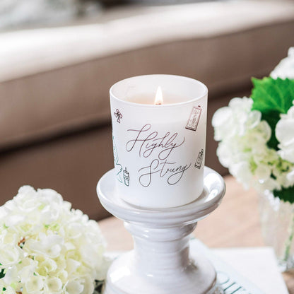 Natural wax glass candle from Avalon Home UK with a clear glass container and a softly glowing wick, ideal for cozy decor.