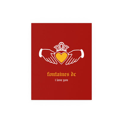 Irish Claddagh poster featuring Fontaines DC "I Love You" design in red and yellow colors, displayed on a wall.
