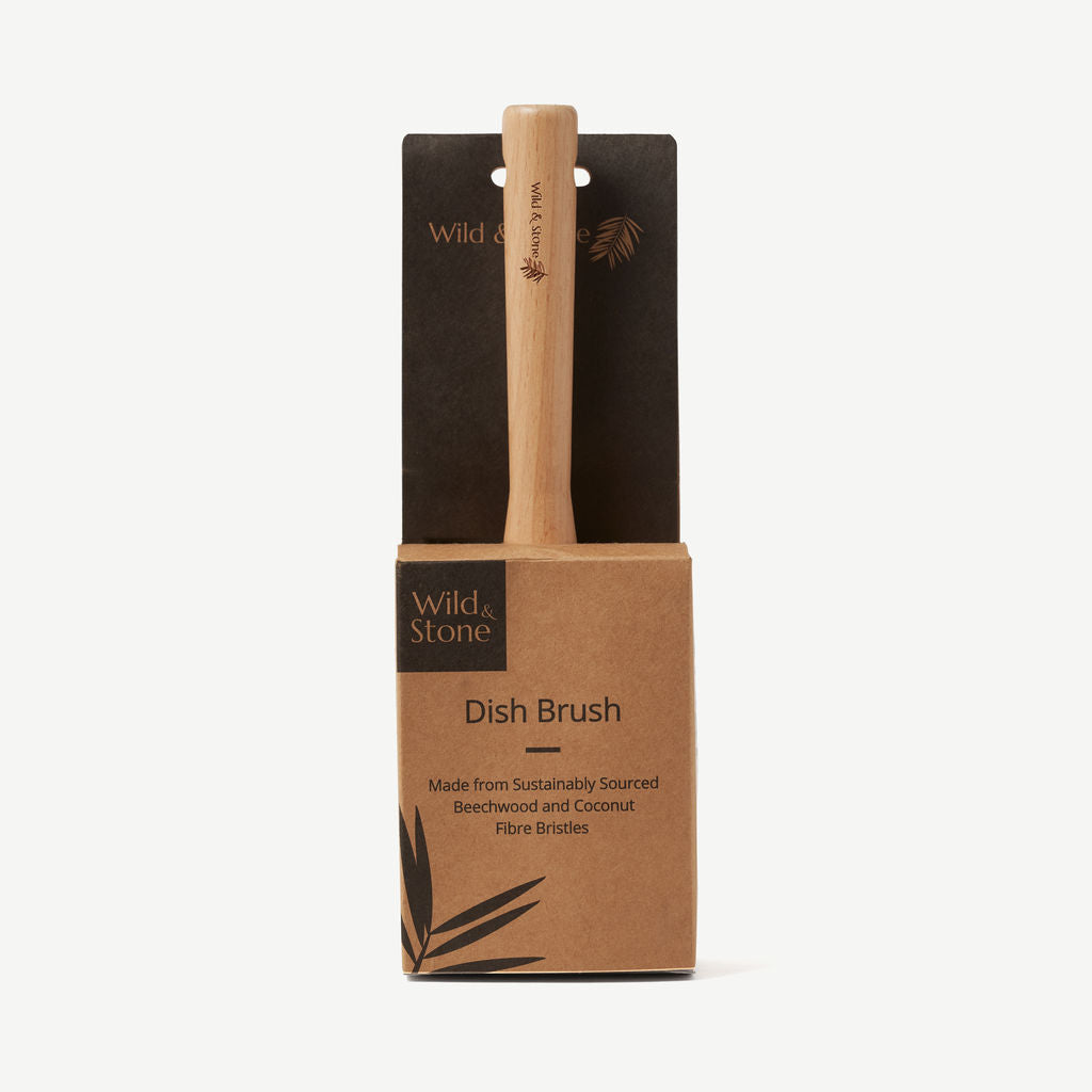 Wild And Stone coconut fiber dish brush with wooden handle, natural cleaning tool for washing dishes and kitchenware.
