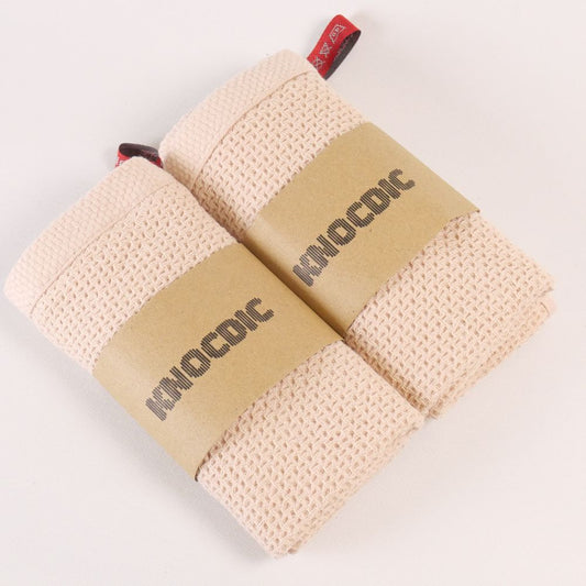 Two KNOCDIC® premium coffee cloths, 34x34 cm, made for baristas, featuring soft cotton material on a clean surface.