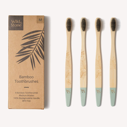 Wild and Stone adult bamboo toothbrush with medium bristles, shown in a four-pack, eco-friendly and biodegradable dental care product