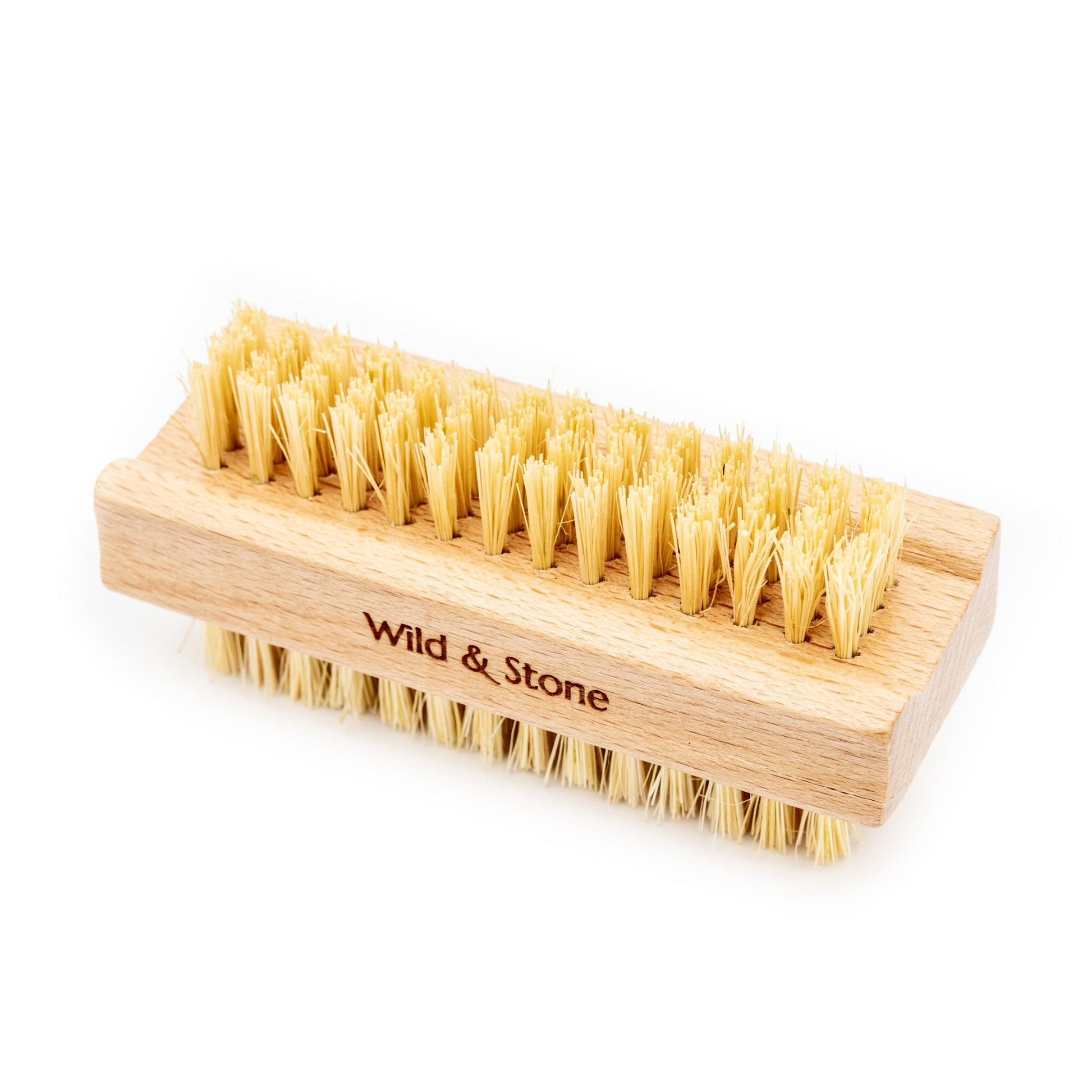 Wild And Stone biodegradable natural bristle nail brush with wooden handle for cleaning nails and cuticles.