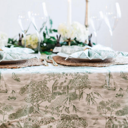 Avalon Home UK Lake District Toile tablecloth with traditional blue and white scenic pattern, draped over a dining table.