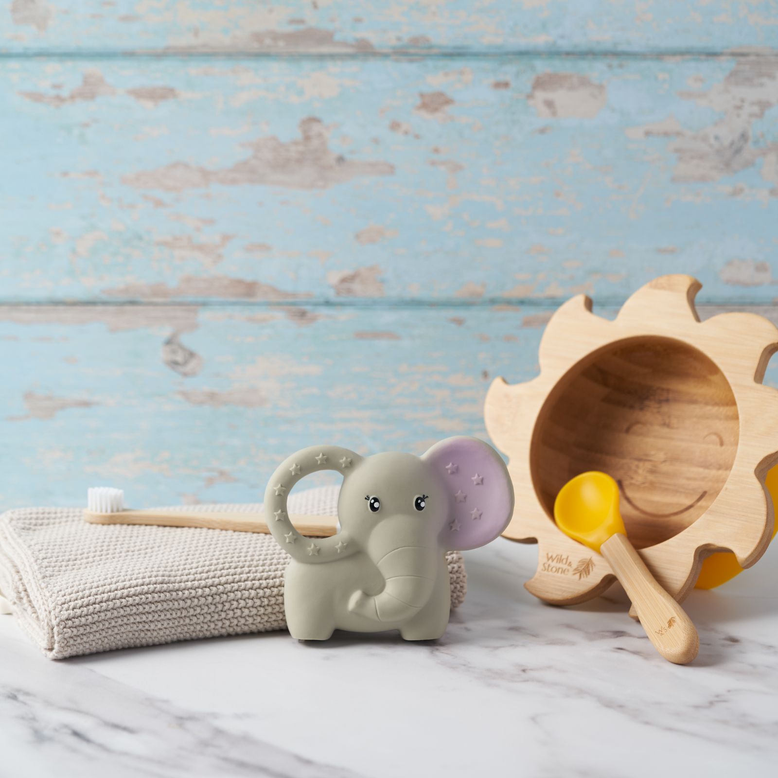 Natural rubber baby teether by Wild And Stone, soft and colorful infant teething toy for soothing and teething relief.