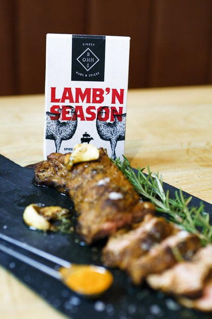 Book cover for "Lamb'N Season" spice seasoning recipe guide by BOHNS Rubs, featuring colorful lamb and spice illustrations.