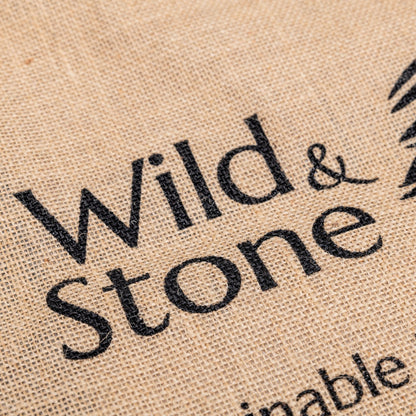 Natural jute Hessian shopping bag from Wild And Stone, featuring sturdy handles and eco-friendly design.