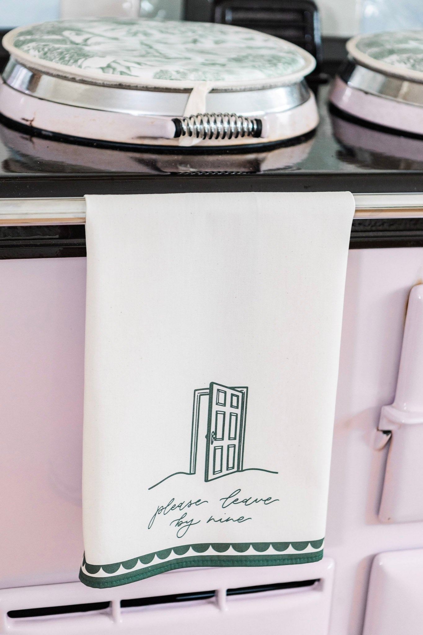 Avalon Home UK Please Leave By Nine tea towel with printed text, featuring a white fabric design for kitchen decor.