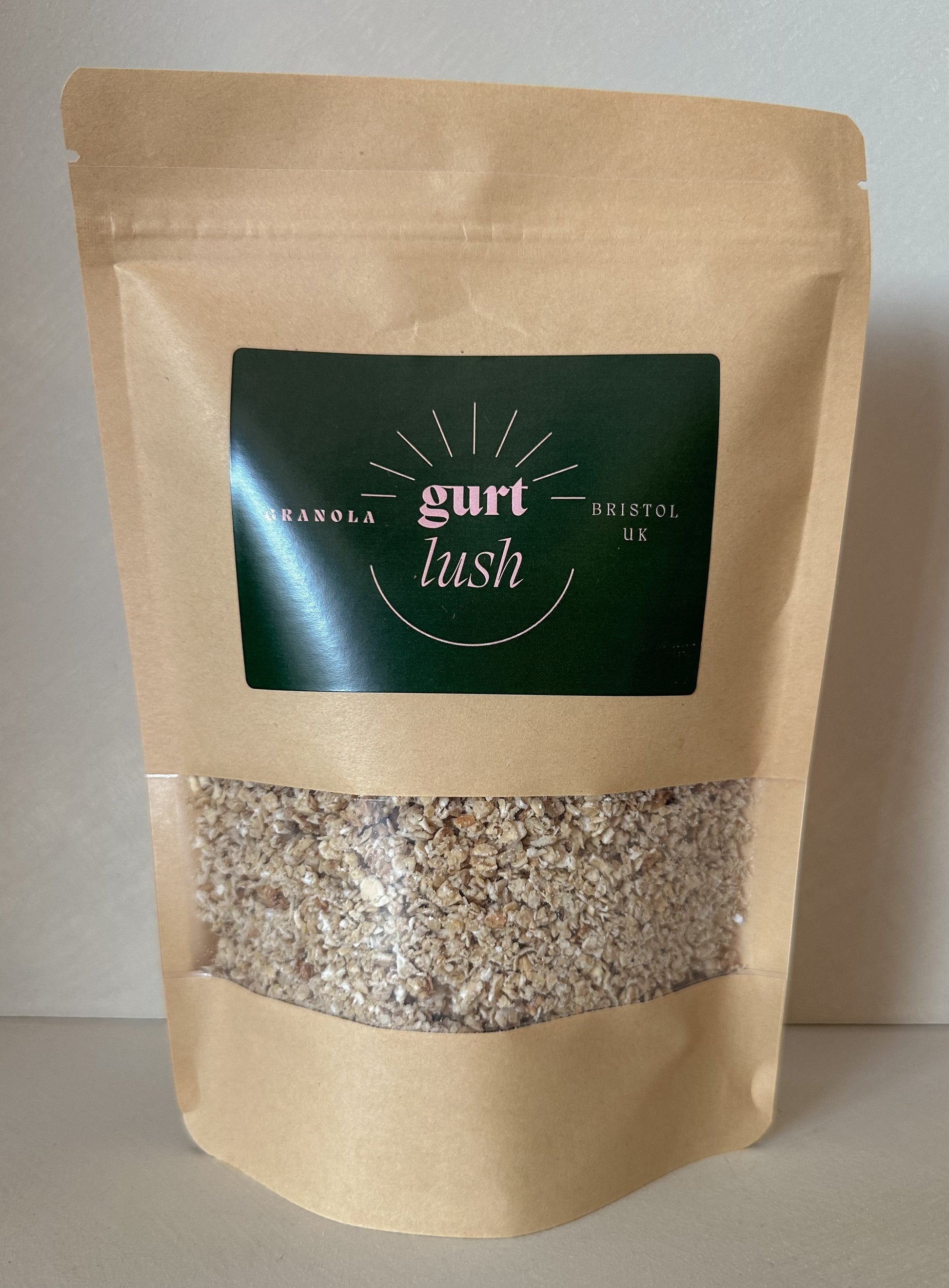Honey and vanilla granola from Gurt Lush Food Co with clusters of oats, honey, vanilla, and nuts in a bowl.
