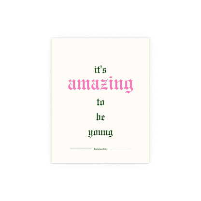 Off-white Fontaines DC poster titled "It's Amazing To Be Young" featuring band artwork, displayed on a plain background.