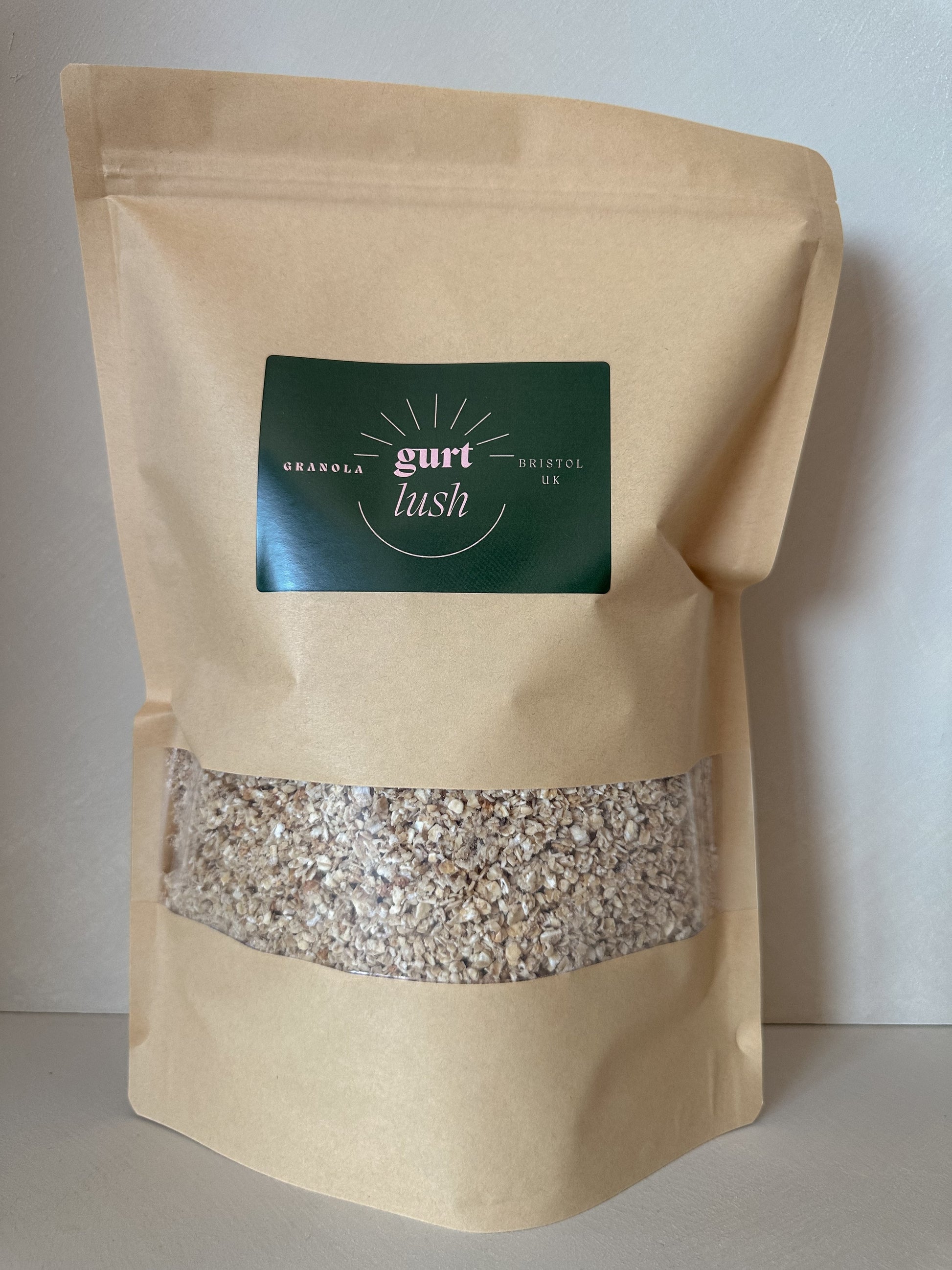 Honey and vanilla granola by Gurt Lush Food Co displayed in a bowl with visible oats, honey drizzle, and vanilla beans.