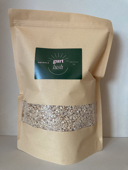 Honey and vanilla granola by Gurt Lush Food Co displayed in a bowl with visible oats, honey drizzle, and vanilla beans.