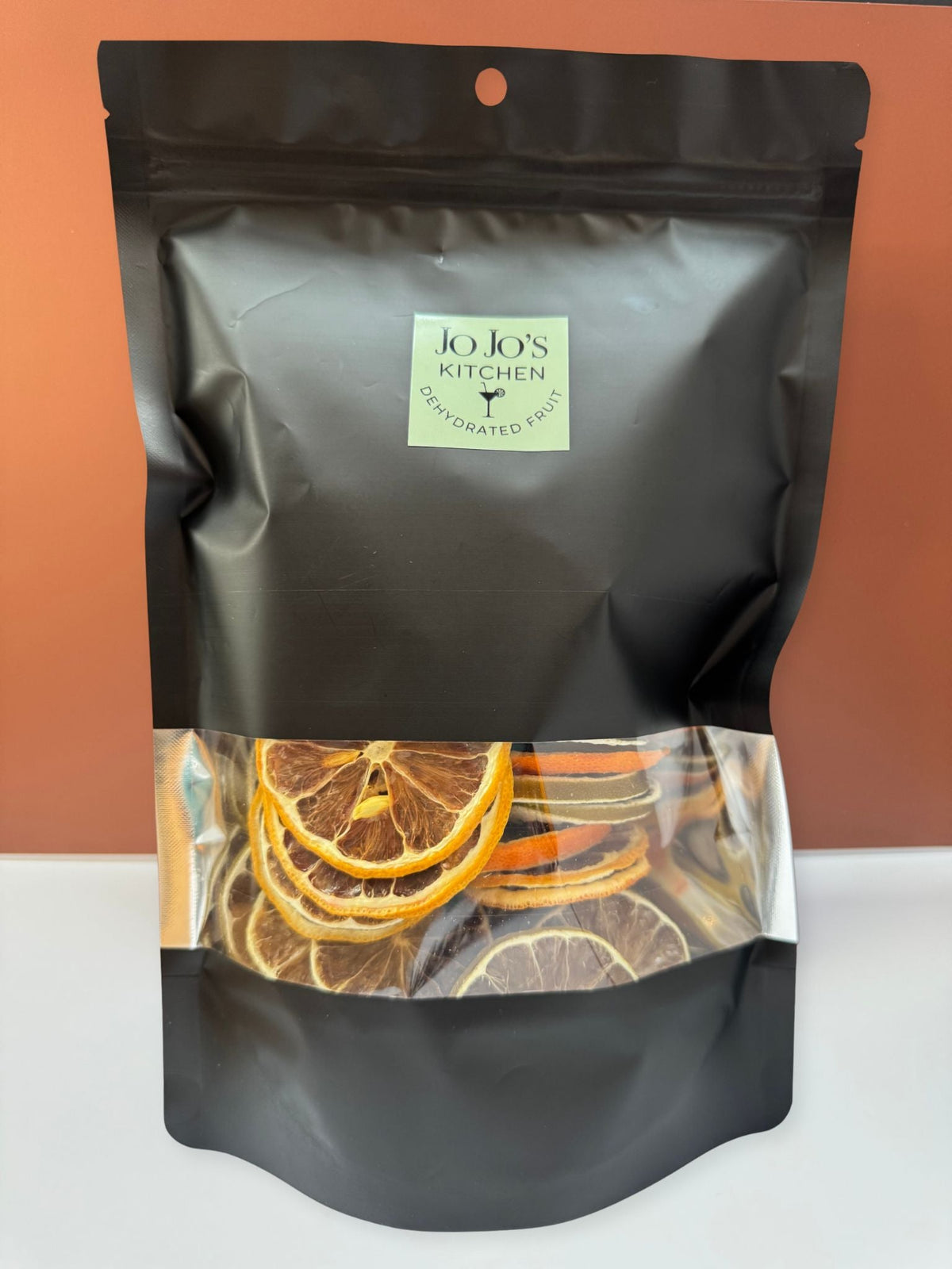 Dried lemon slices from JoJo’s Kitchen, thinly dehydrated lemon pieces with bright yellow color and textured surface.
