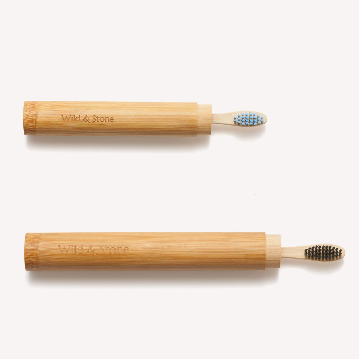Child's bamboo toothbrush travel holder in natural bamboo with a lid, designed for kids' Wild And Stone bamboo toothbrushes.