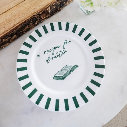 Bone china plate featuring a colorful, detailed recipe for disaster design by Avalon Home UK, perfect for elegant dining.
