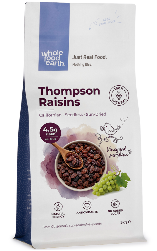 Whole Food Earth Californian Thompson Seedless Raisins in a clear container, showcasing dried fruit with golden and dark raisins.