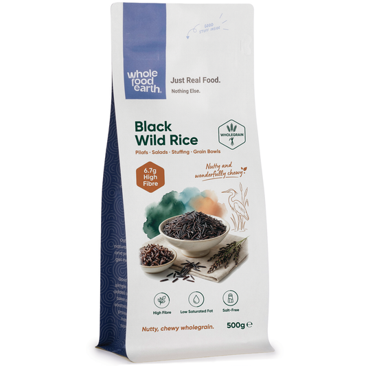 Black Wild Rice from Whole Food Earth, USA, shown in a bowl with individual rice grains visible, raw and uncooked.