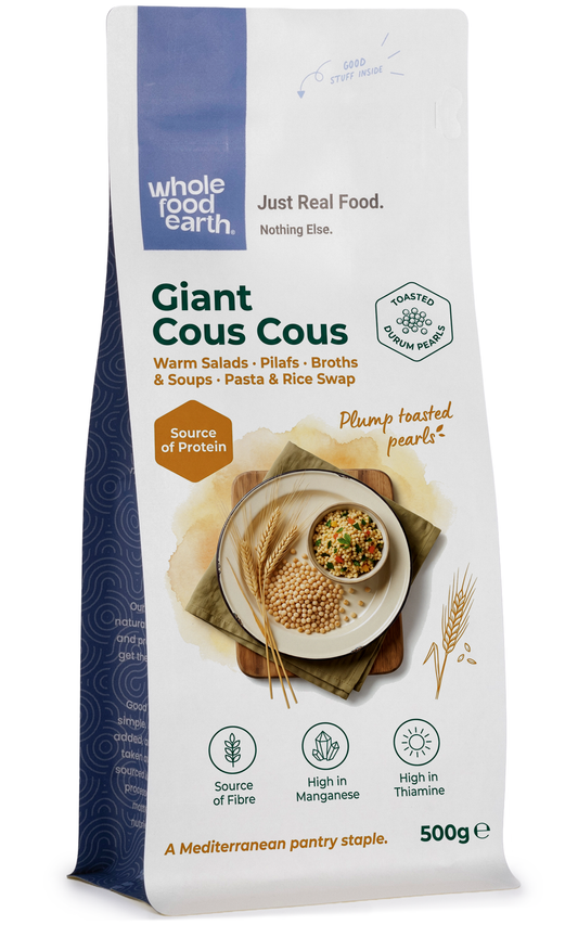Whole Food Earth giant couscous in a bowl, showcasing large, golden pearl-like grains from the rice and couscous product.