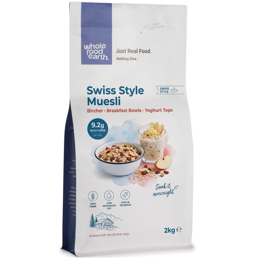 Swiss Style Muesli cereal from Whole Food Earth featuring flakes, dried fruit, and nuts in a colorful bowl.