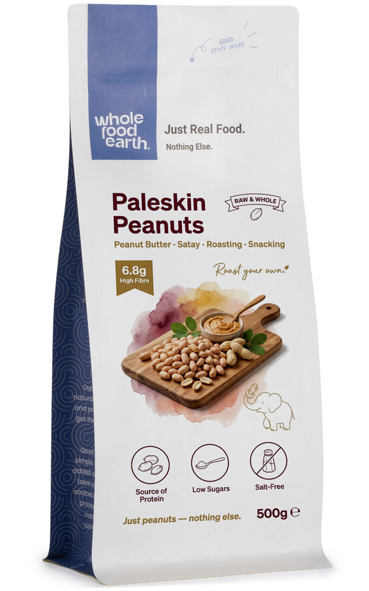 Whole Food Earth Paleskin Peanuts in a bowl, showing their natural light brown shells and crunchy texture, for nuts and seeds.