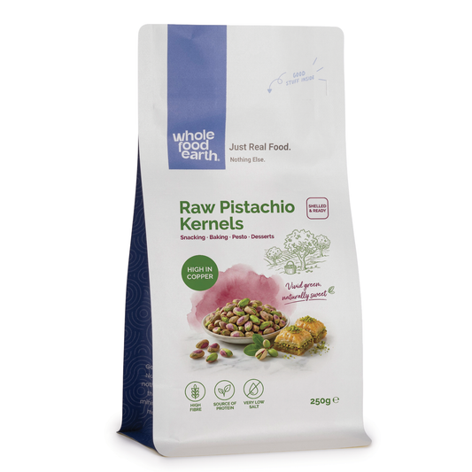 Raw pistachio kernels from ArtisanBox, close-up of green and beige nut kernels in a natural state.