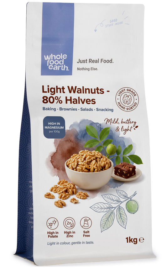 Light walnuts in 80% halves from Whole Food Earth, showcasing fresh, natural nut halves in a clear view.