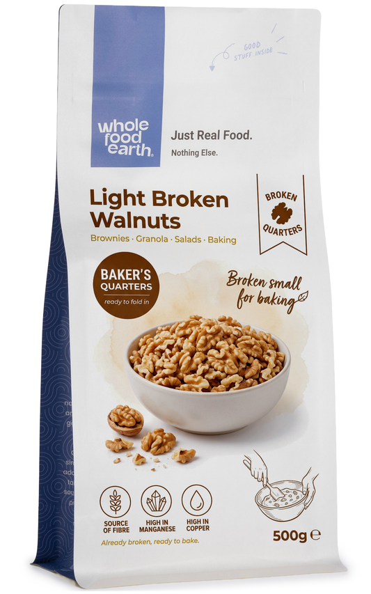 Whole Food Earth light broken walnuts in quarters, raw nuts and seeds for snacking or baking.