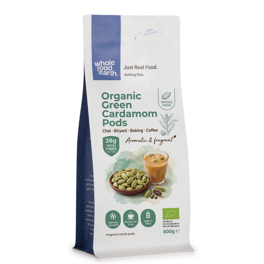 Organic green cardamom pods from Whole Food Earth, fresh herbs and spices, showing whole green pods with natural texture.