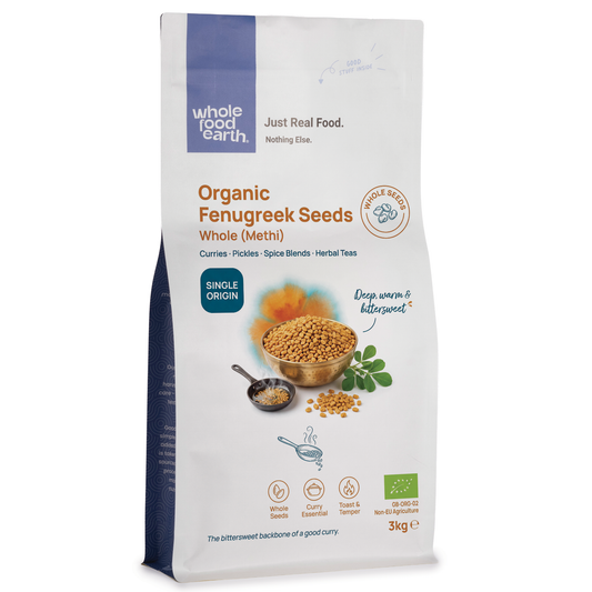 Whole Food Earth organic fenugreek seeds, whole herbs and spices in a clear container, ready for cooking or herbal remedies.