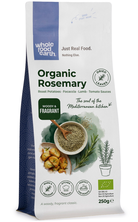 Dried organic rosemary herbs from Whole Food Earth, showing green needle-like leaves in a close-up image.