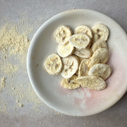 Freeze dried sliced banana from Whole Food Earth, dried fruit snack with crispy banana slices on a white background.