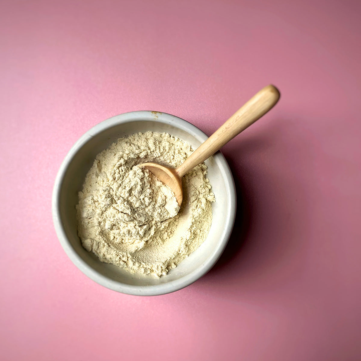 Freeze dried mango powder from Whole Food Earth, bright orange dried fruit powder in a clear jar.