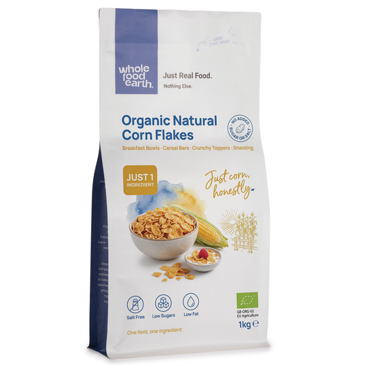 Organic natural corn flakes cereal from Whole Food Earth, showing a bowl of crispy, golden corn flakes on a white background.