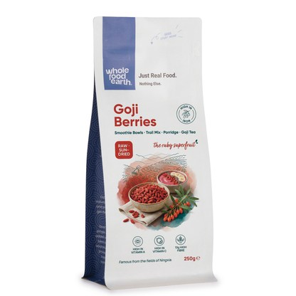Dried goji berries from Whole Food Earth, vibrant red dried fruits with a slightly wrinkled surface, arranged in a pile.