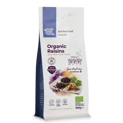 Organic raisins, dried fruit by Whole Food Earth, showing plump, glossy raisins in a natural close-up shot.